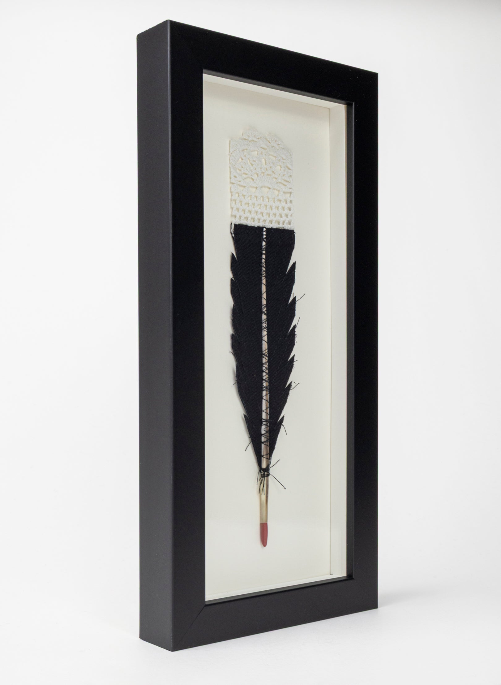 Single Huia Feather Framed