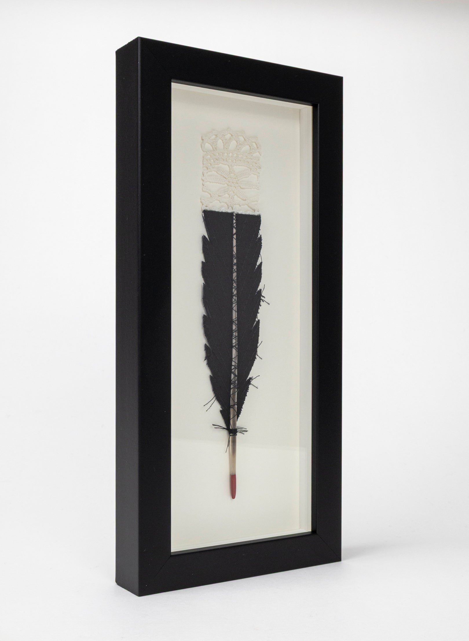 Single Huia Feather Framed