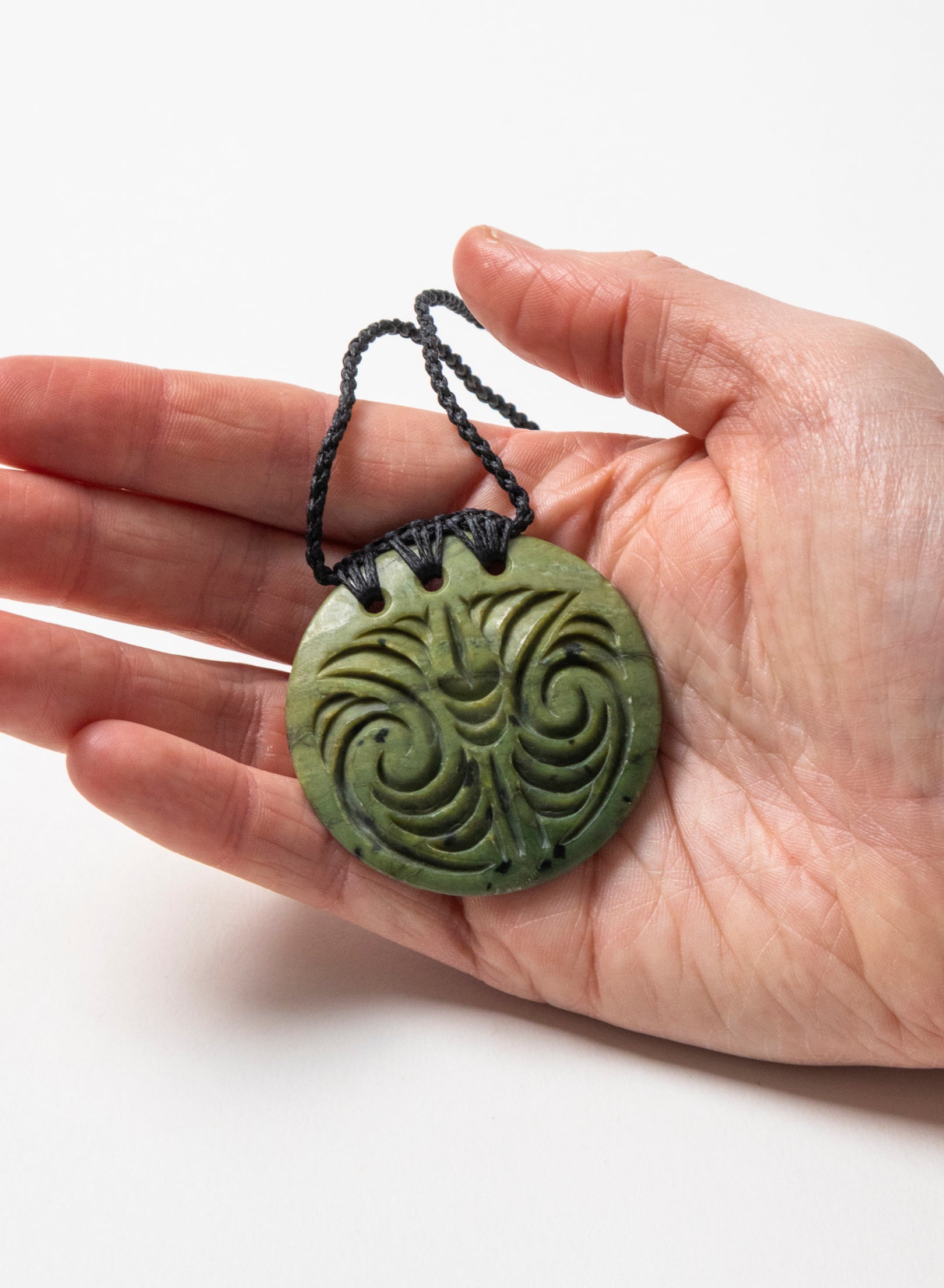 Carved Pounamu Porowhita Disc