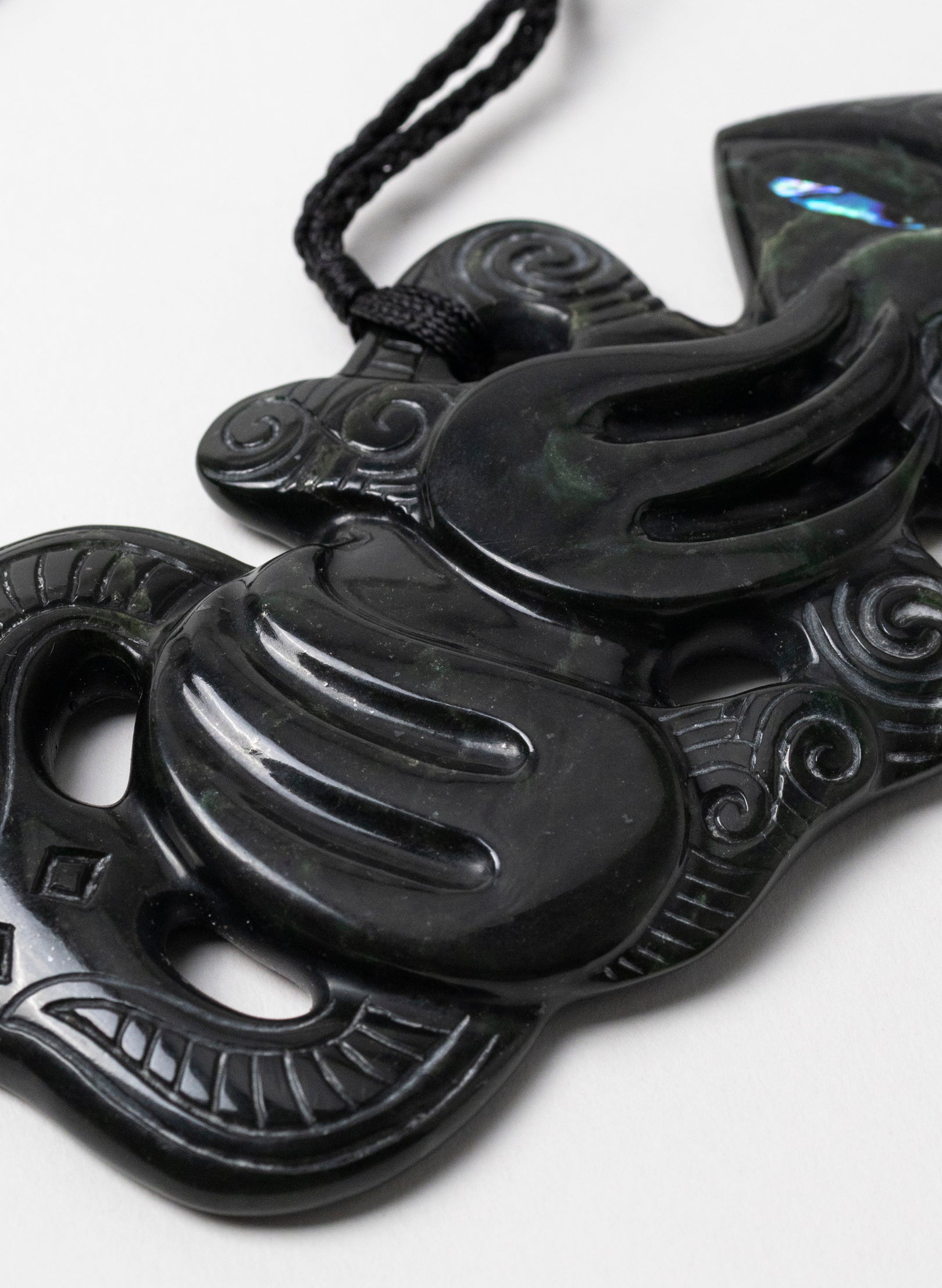 Pounamu Hei Tiki on Stone Base