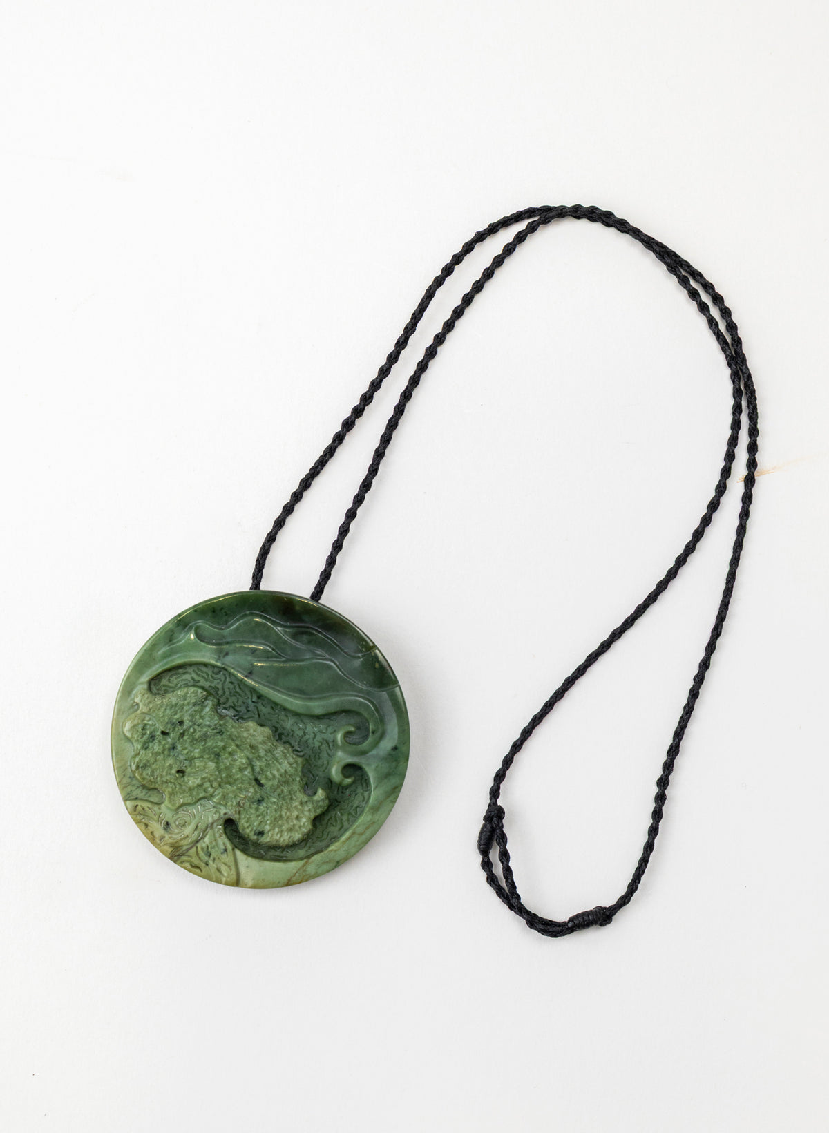 Carved Pounamu Porohita Sculpture on a Stand
