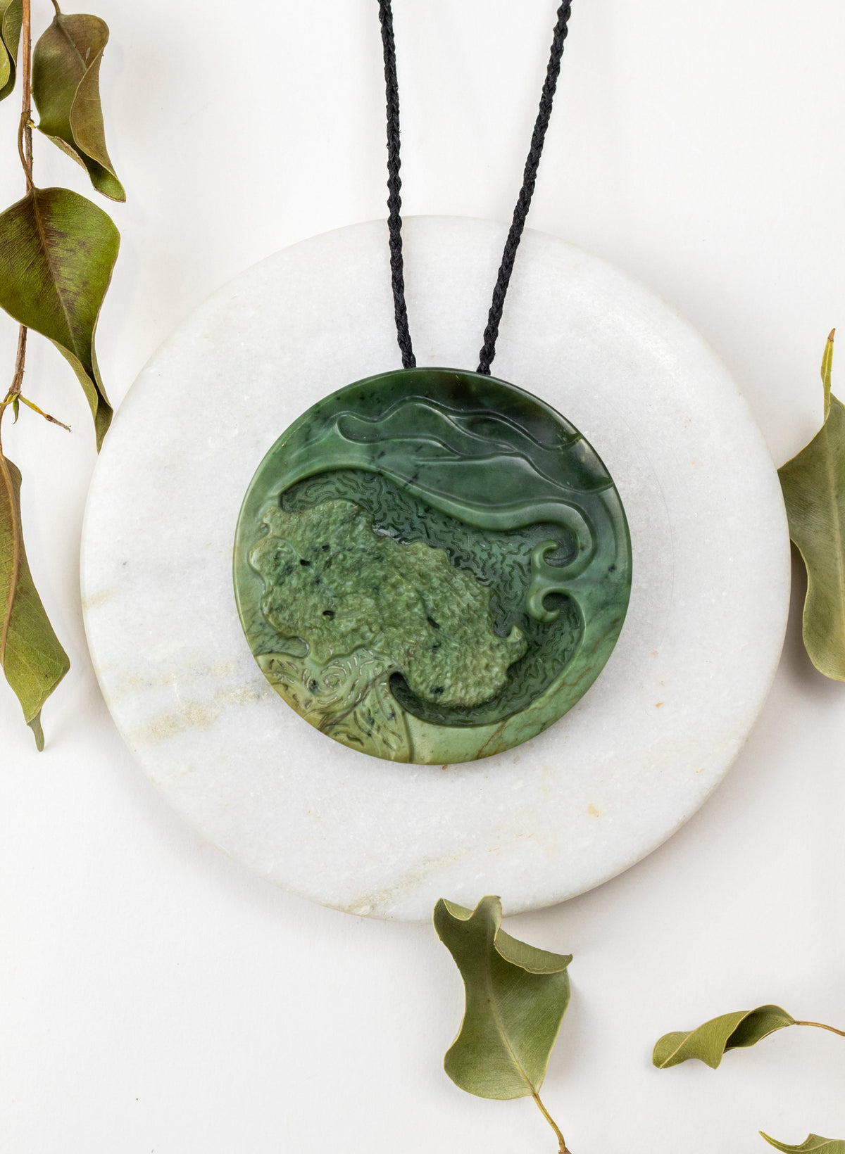 Carved Pounamu Porohita Sculpture on a Stand