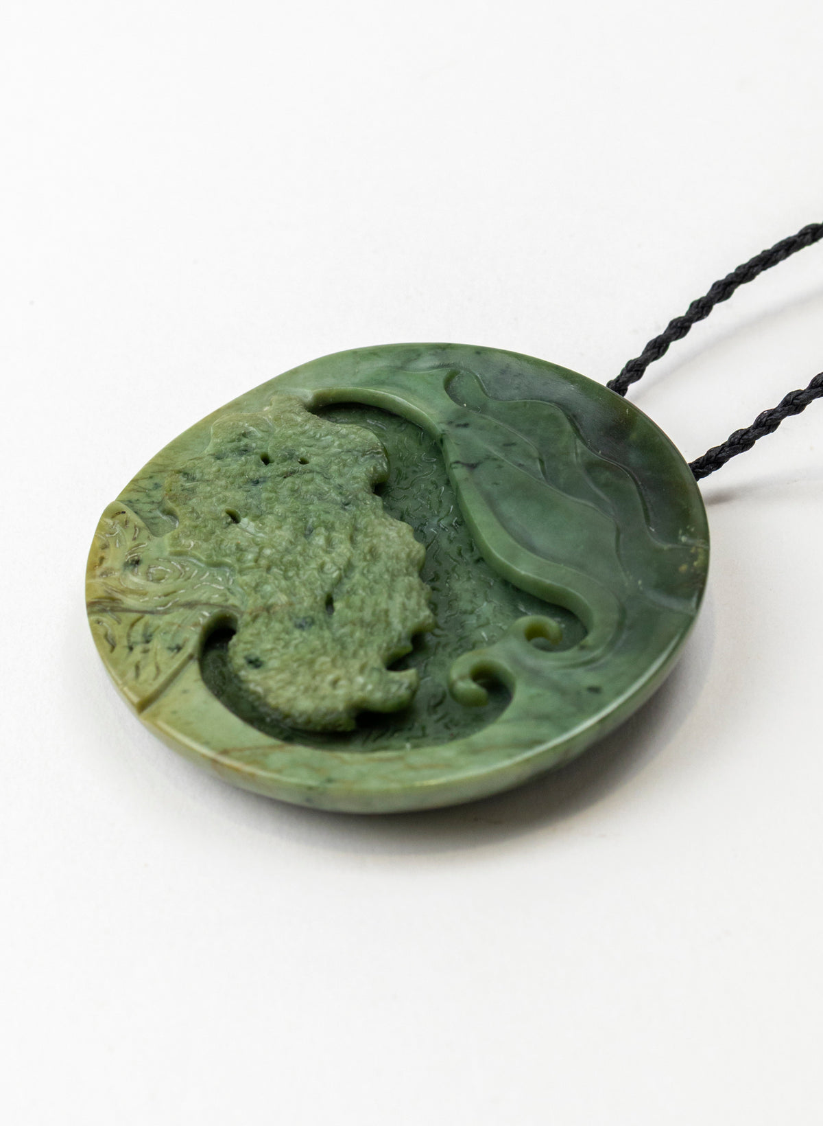 Carved Pounamu Porohita Sculpture on a Stand