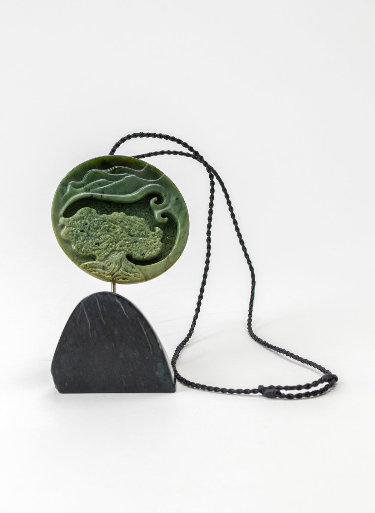 Carved Pounamu Porohita Sculpture on a Stand