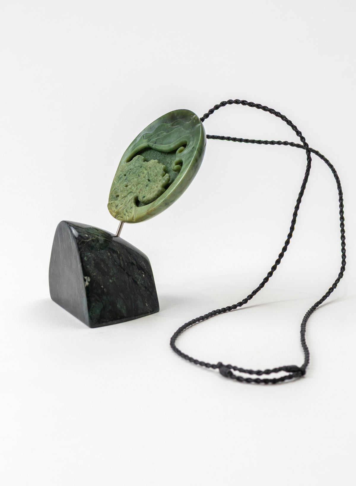 Carved Pounamu Porohita Sculpture on a Stand