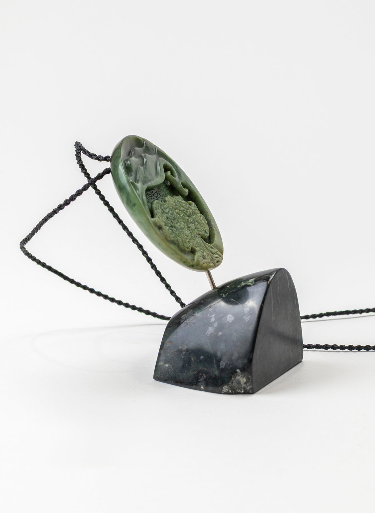 Carved Pounamu Porohita Sculpture on a Stand