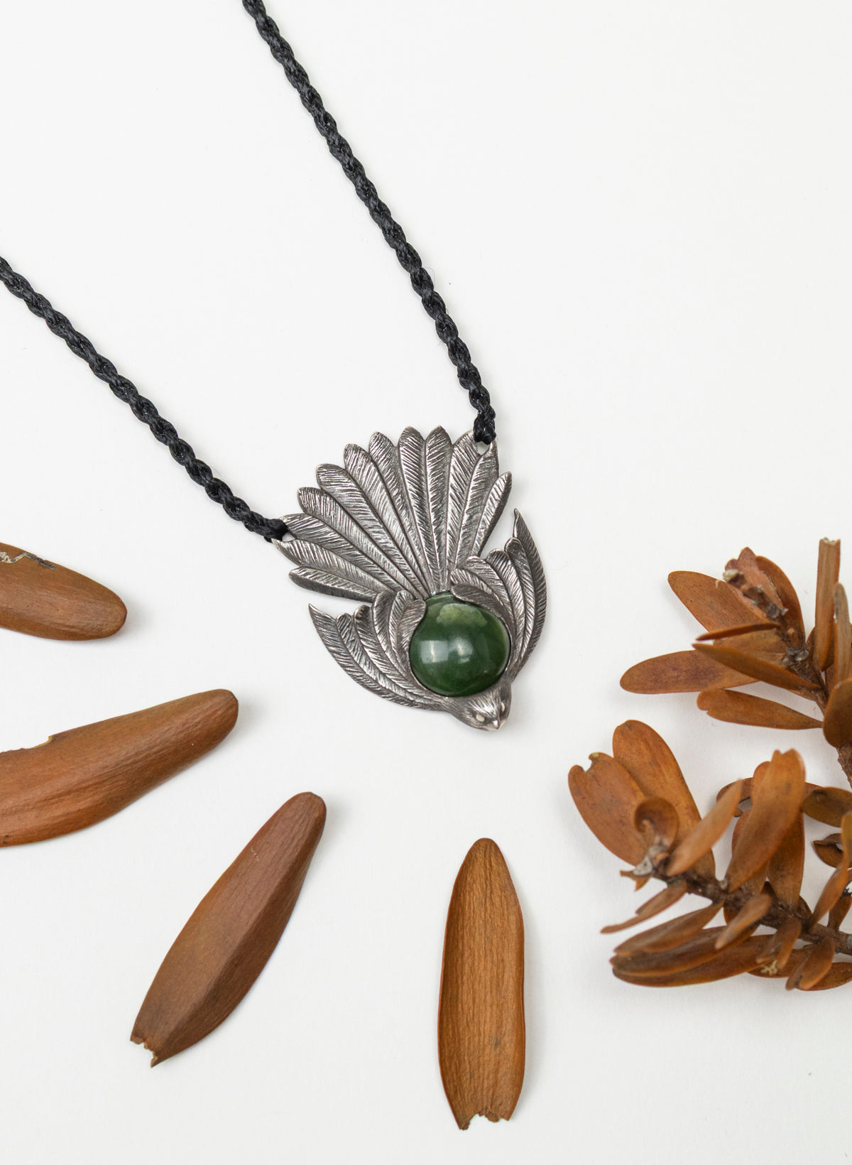 Sterling Silver Piwakawaka Pendant with a Pounamu Insert