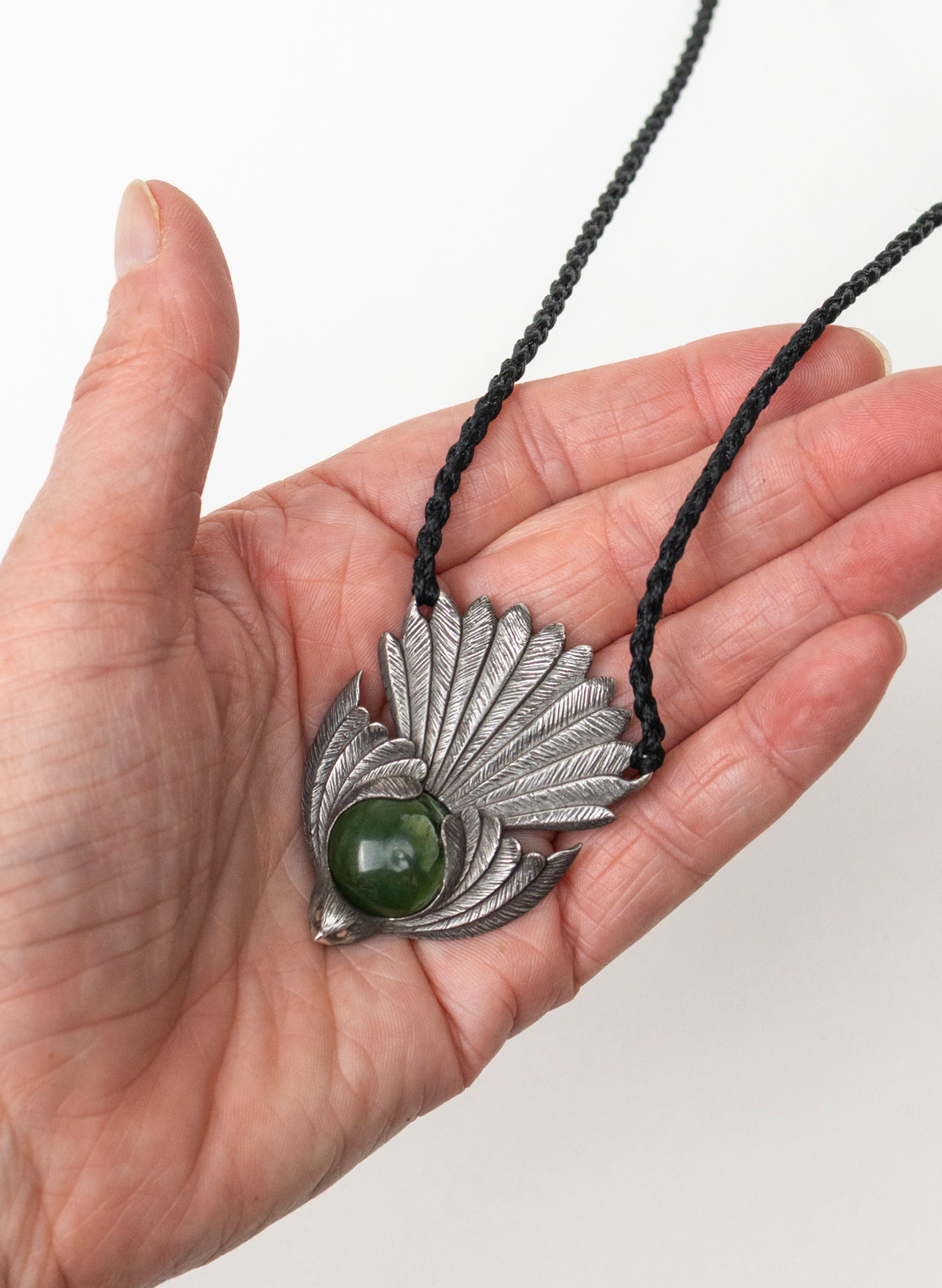 Sterling Silver Piwakawaka Pendant with a Pounamu Insert
