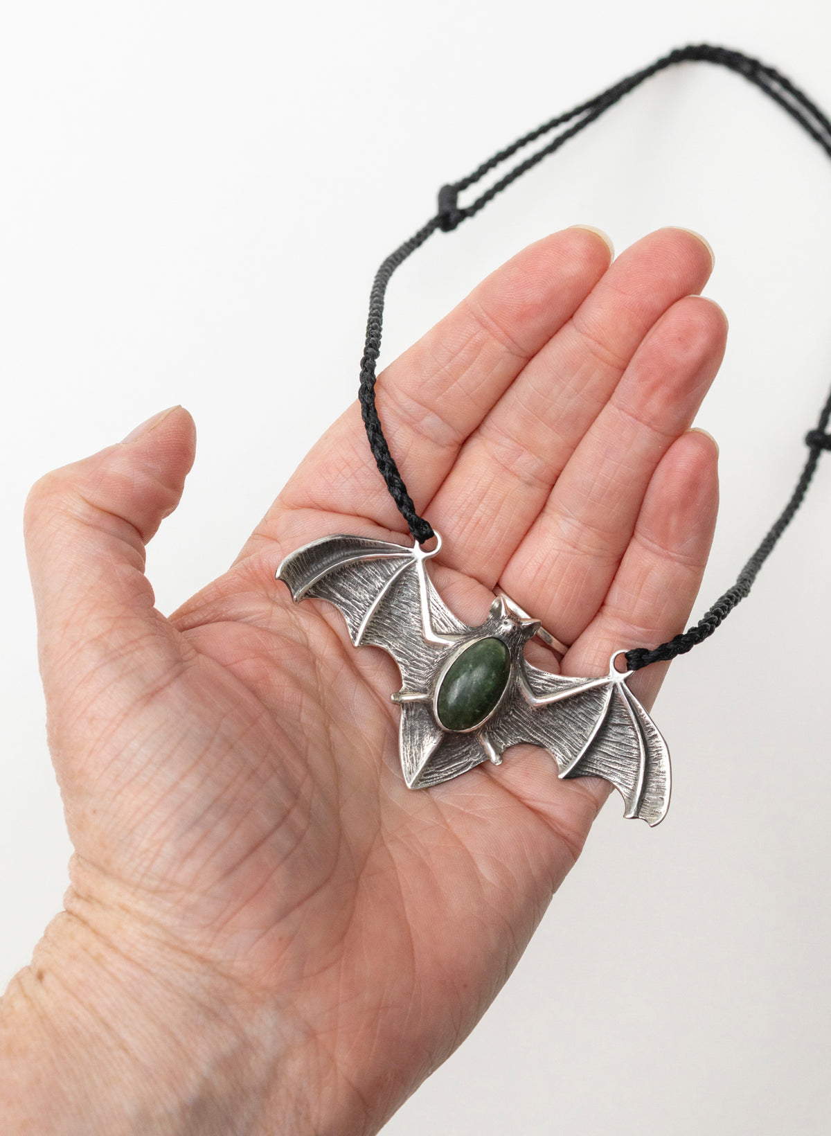 Sterling Silver Pekapeka Pendant with a Pounamu Insert