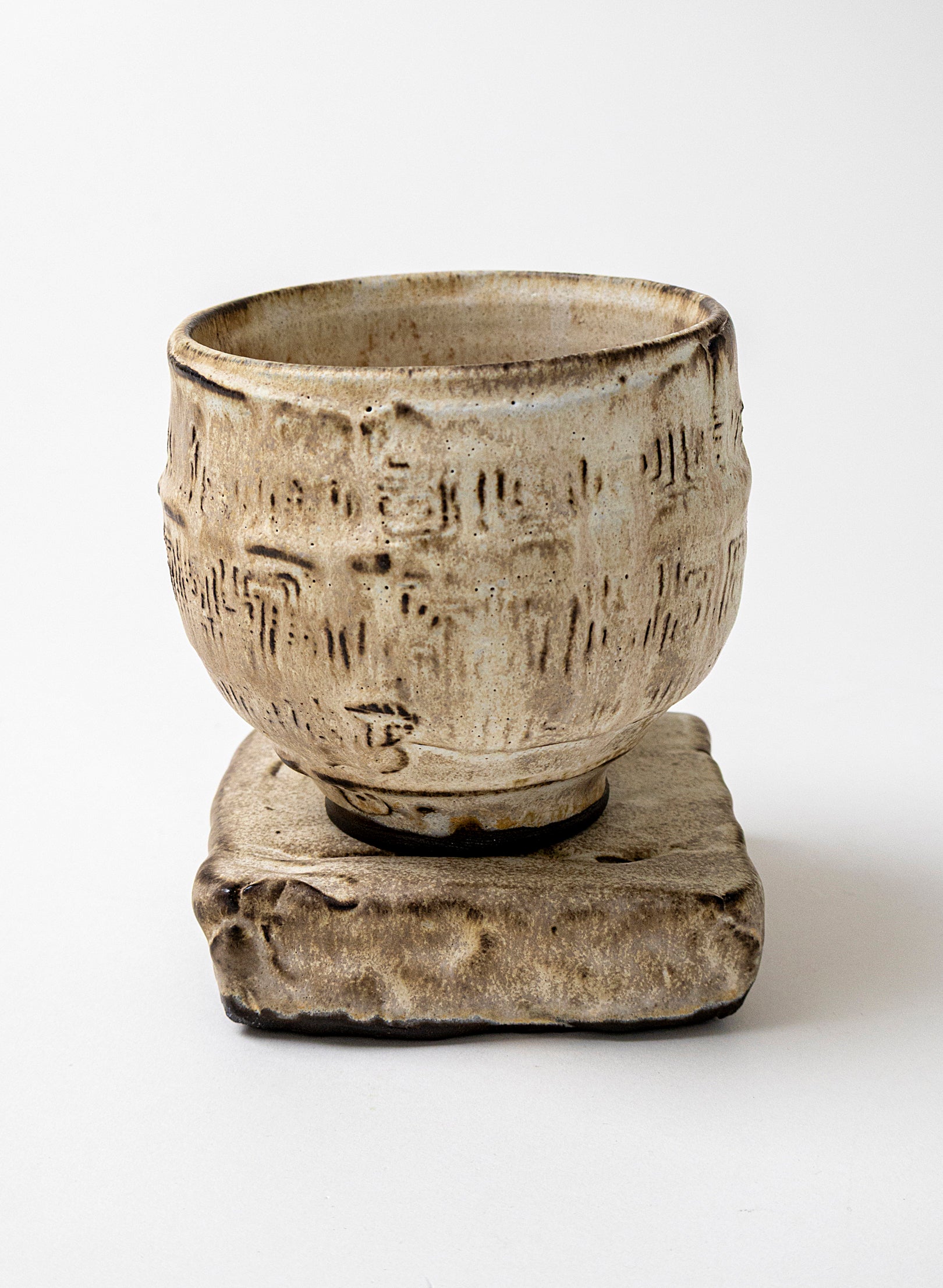 White Ceramic Cup on Pedestal