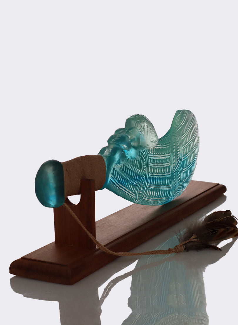 Lagoon Copper Blue and Lead Crystal Glass Wahaika with a Pūkaiora(figure) on an Totara base