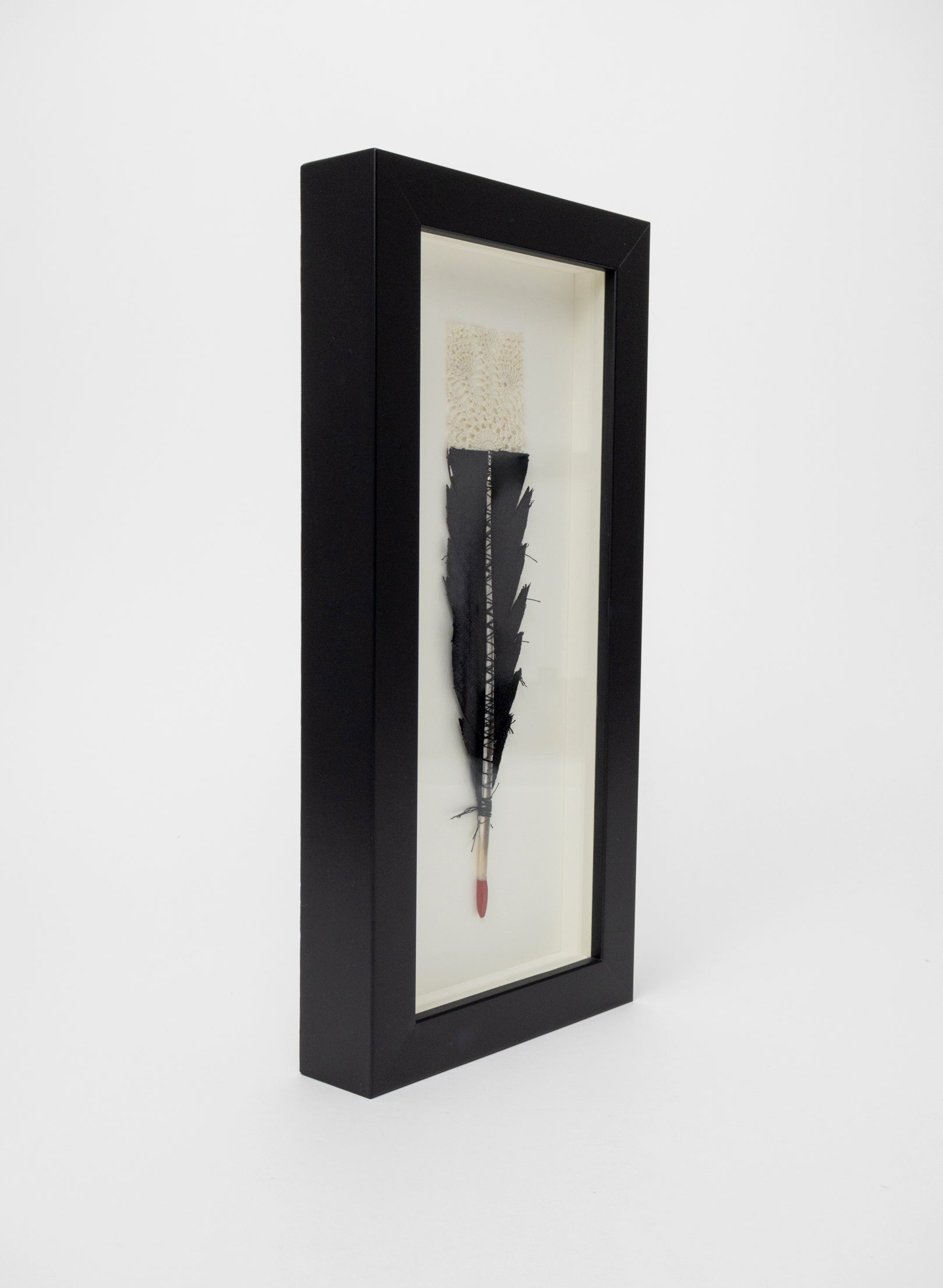 Single Huia Feather Framed