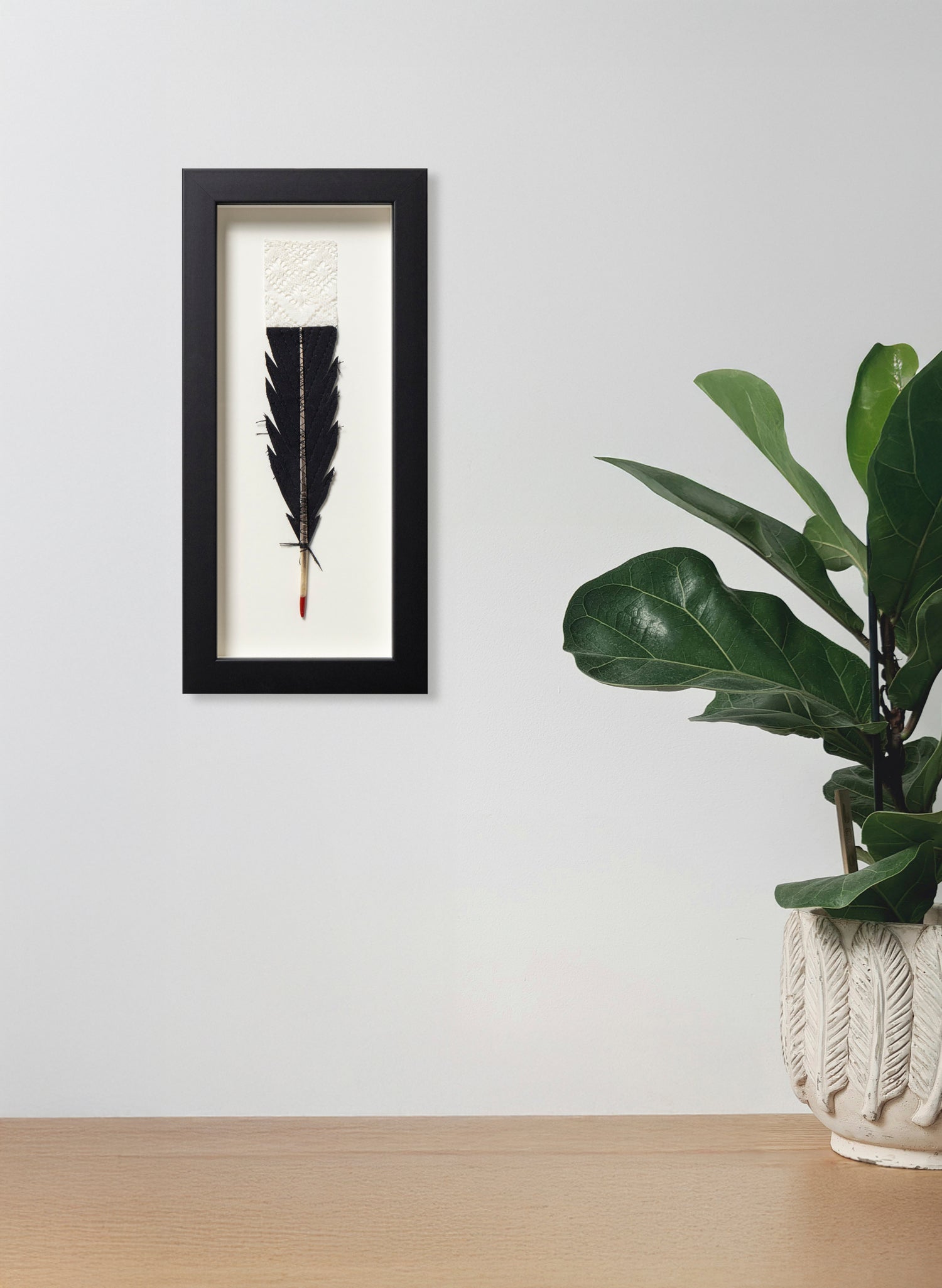 Single Huia Feather Framed