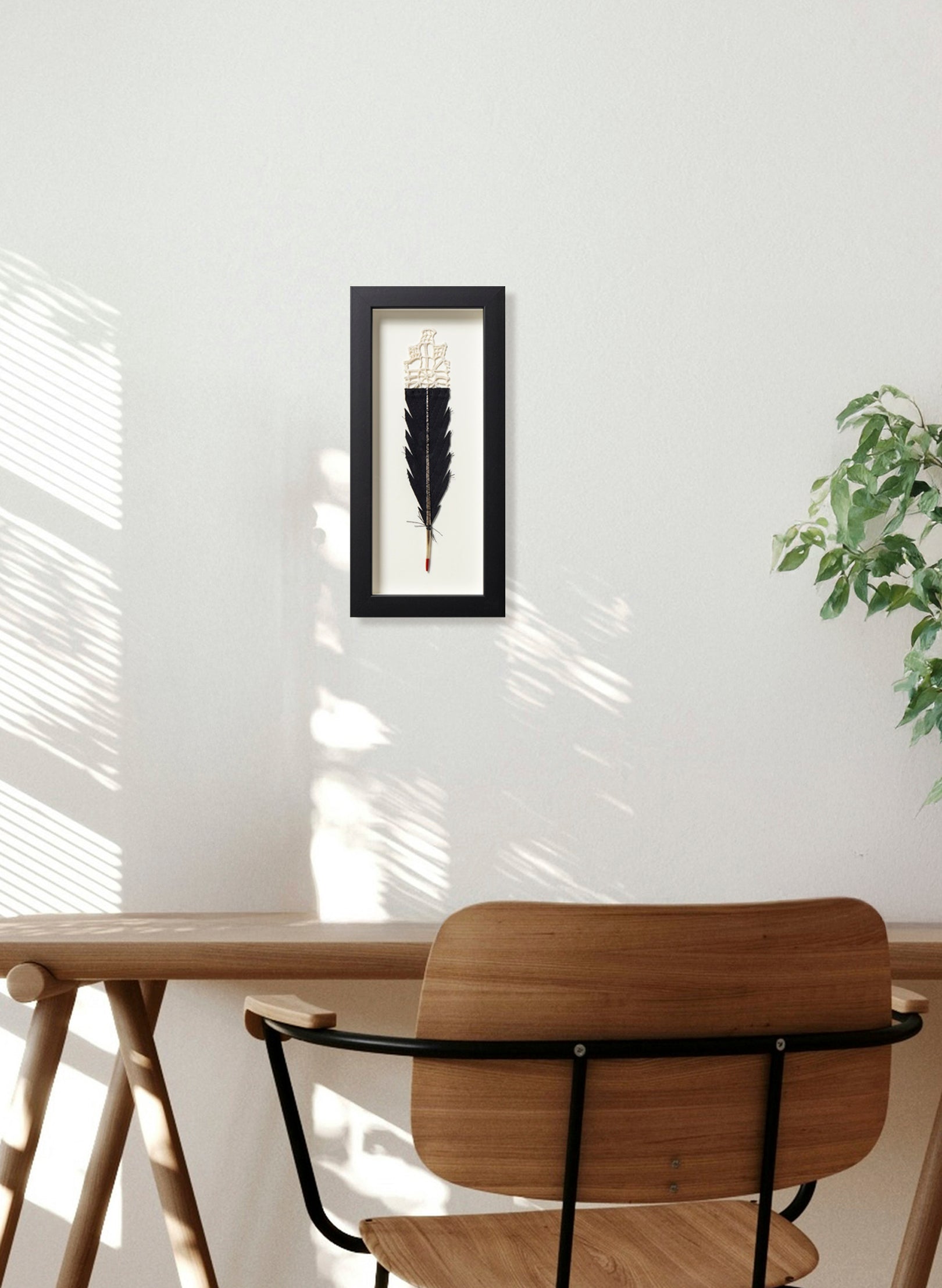 Single Huia Feather Framed