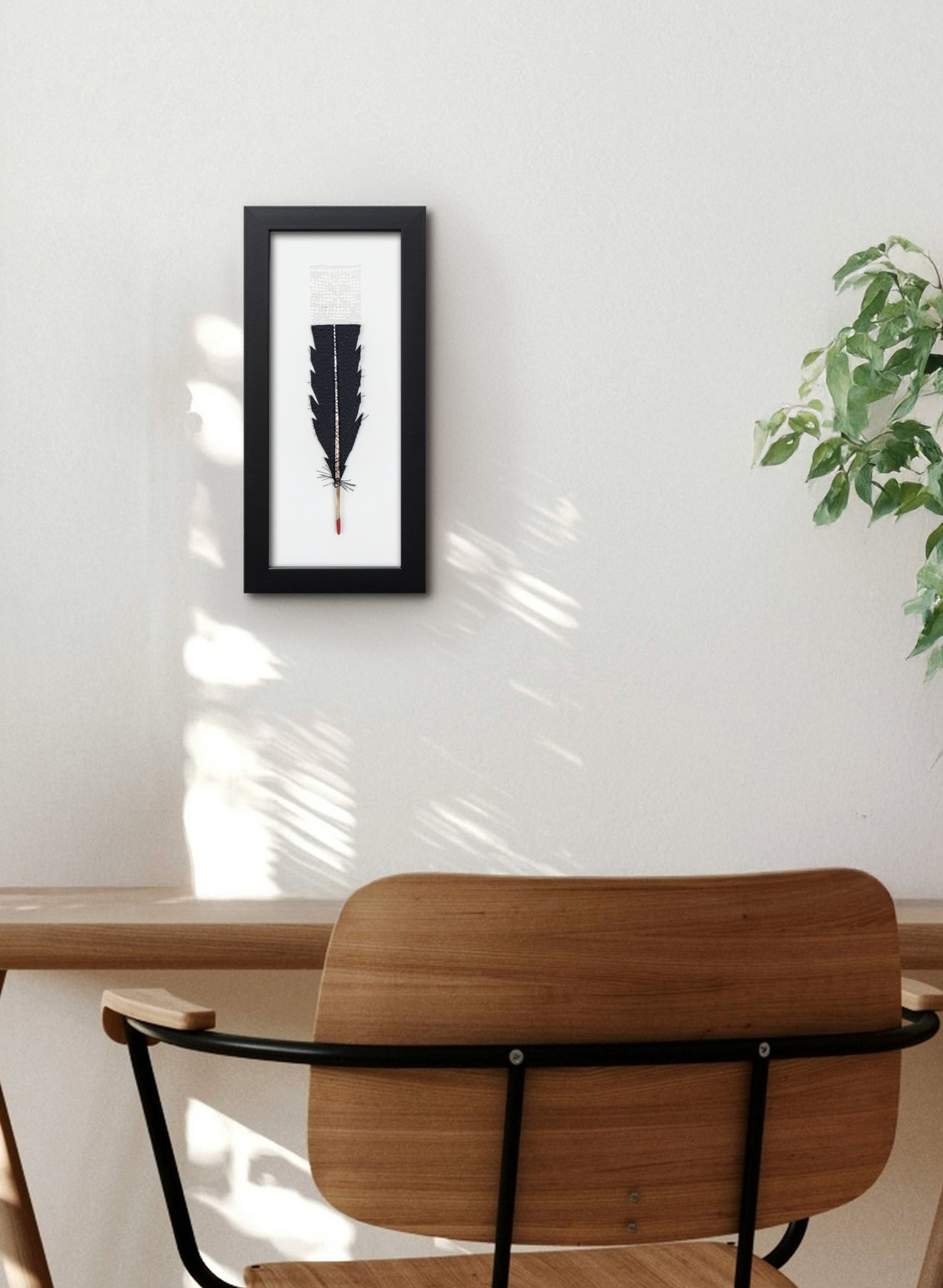 Single Huia Feather Framed