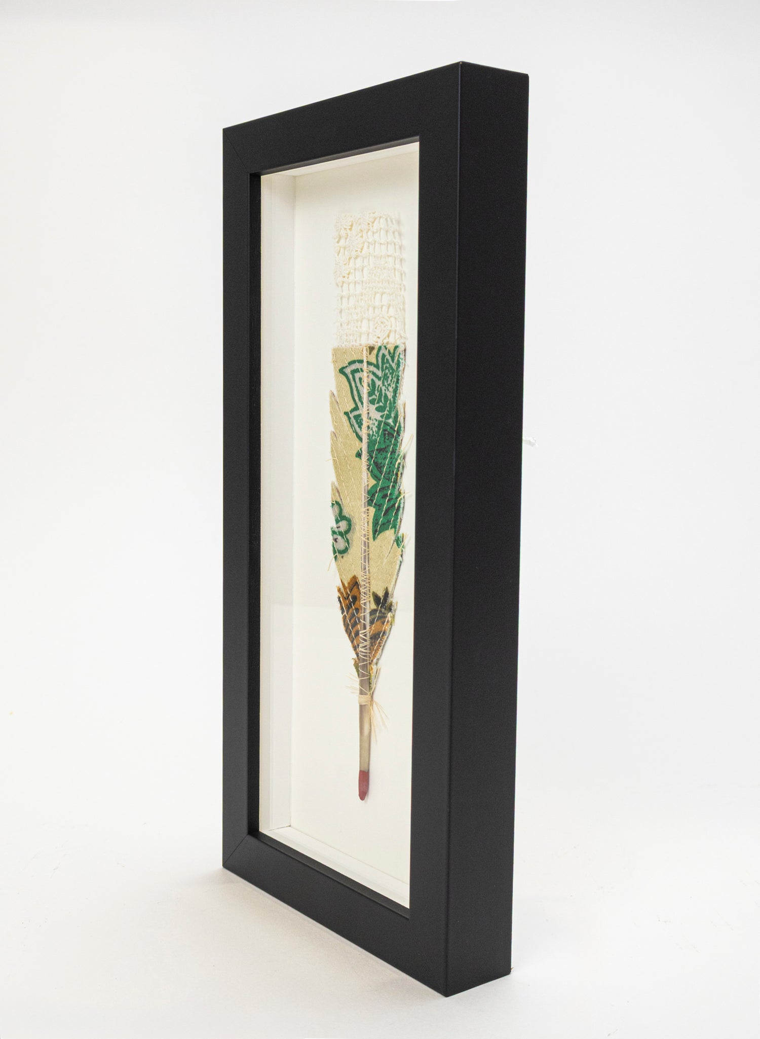Single Huia Feather Framed