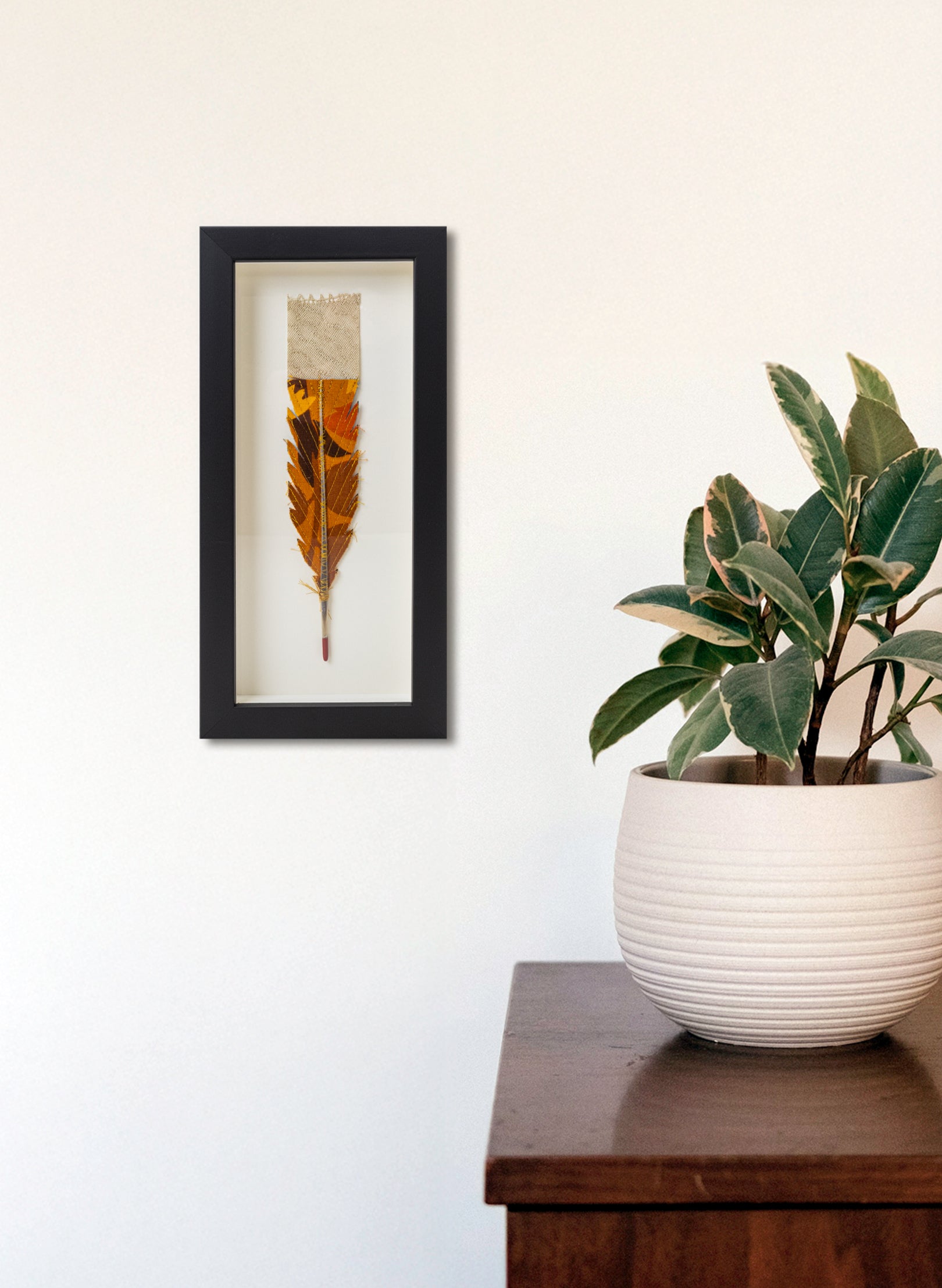 Single Huia Feather Framed