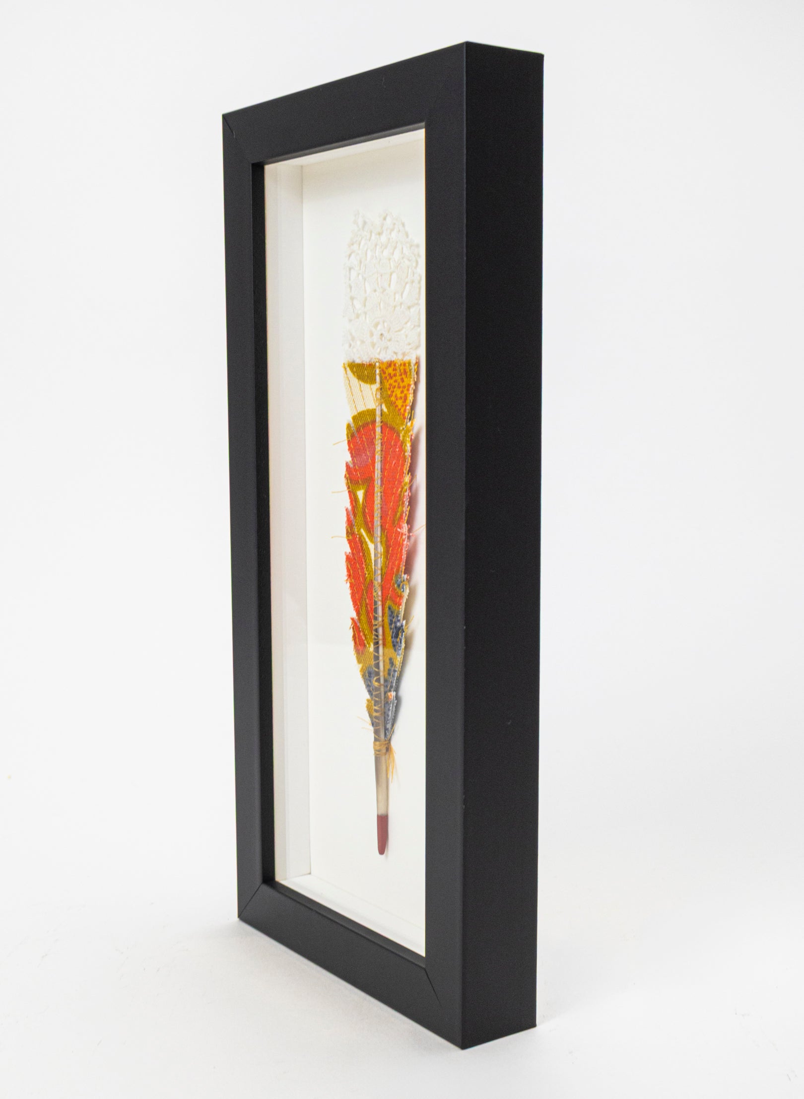 Single Huia Feather Framed