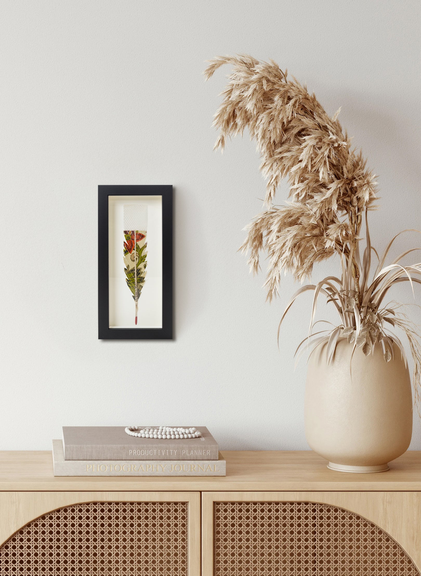 Single Huia Feather Framed