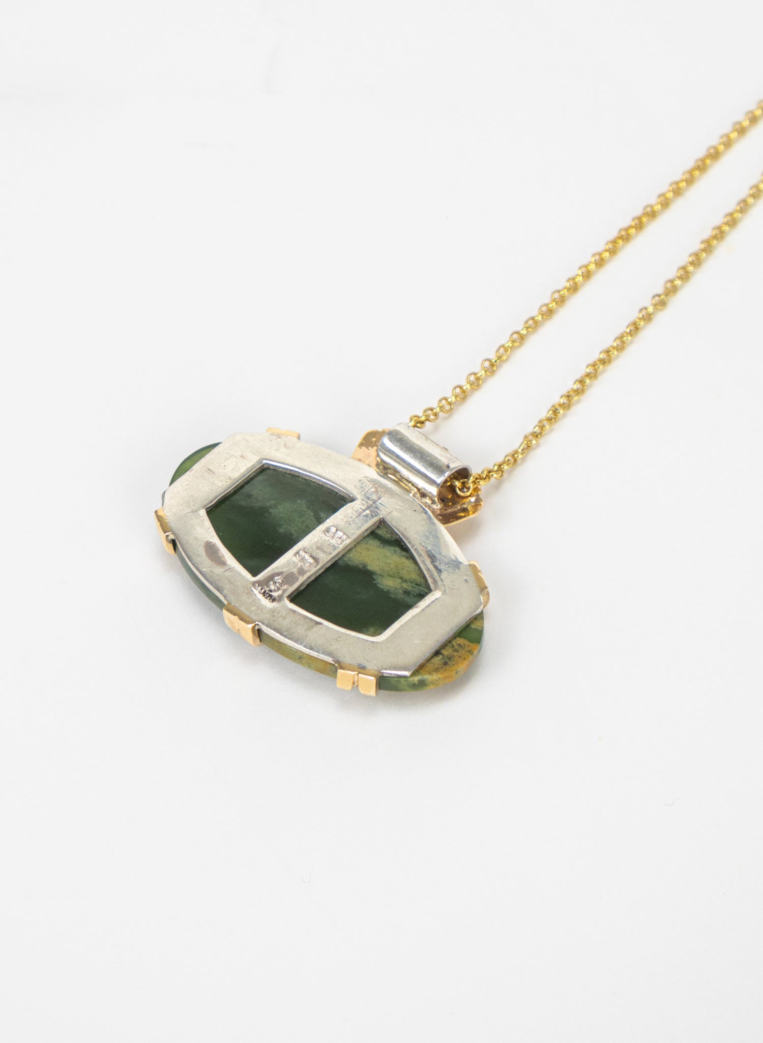 Oval Pounamu Pendant with Gold Fastenings and Silver Mount and Gold Chain