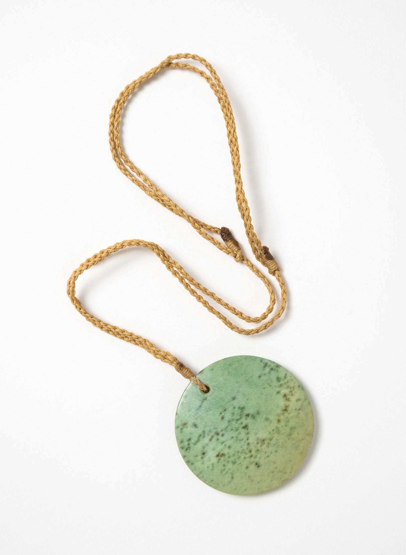 Carved Pounamu Porowhita Disc