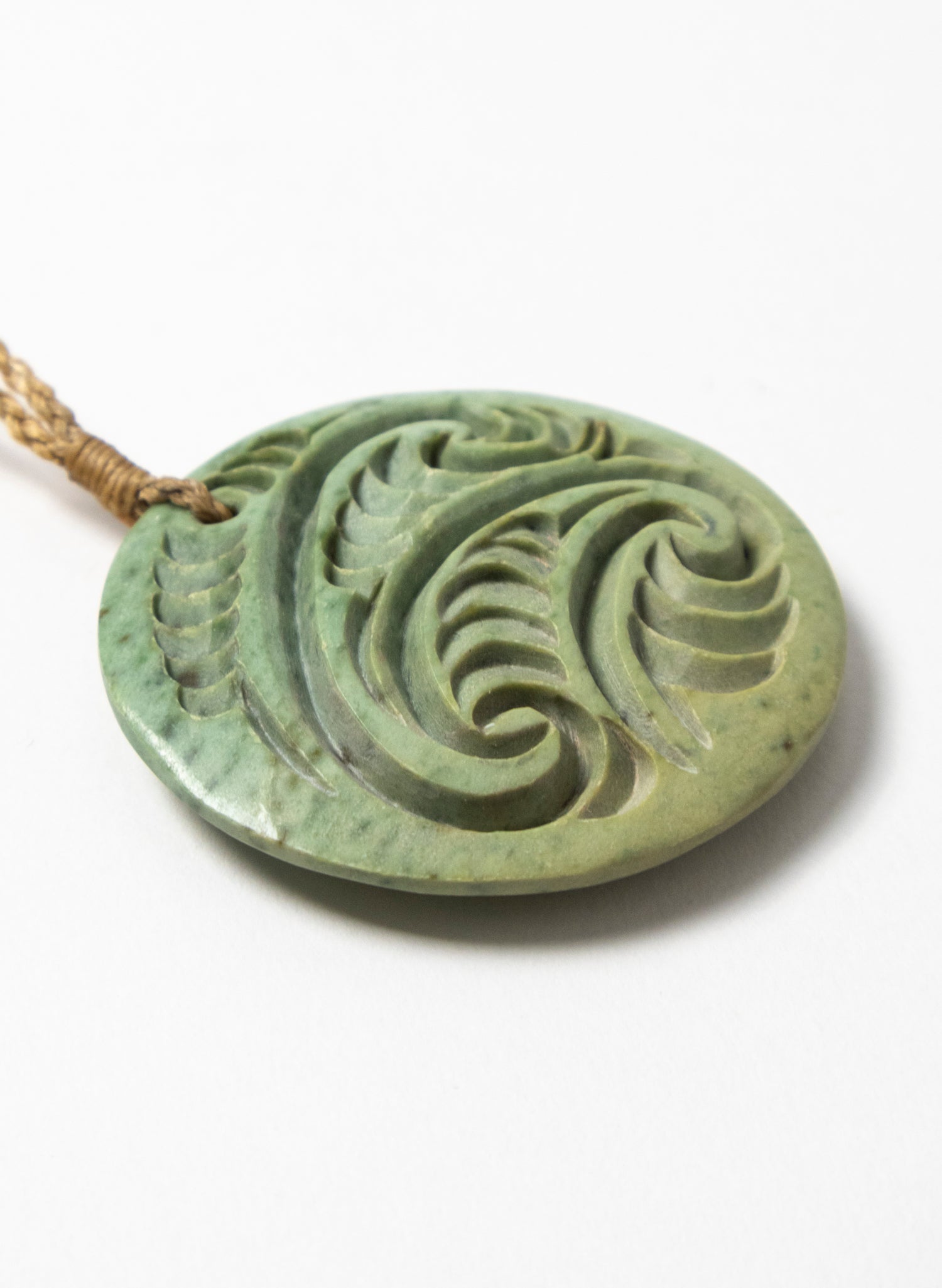 Carved Pounamu Porowhita Disc