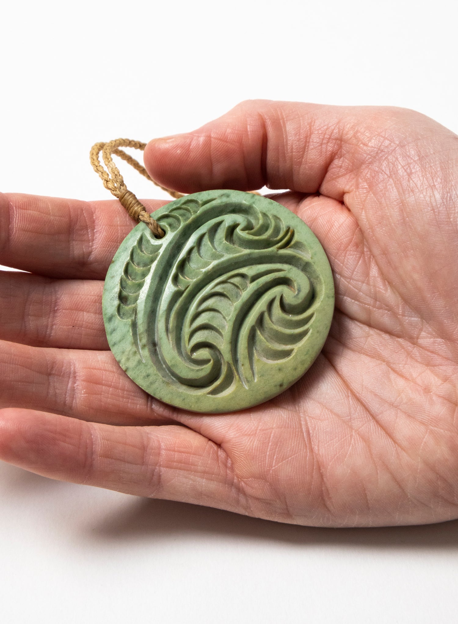 Carved Pounamu Porowhita Disc