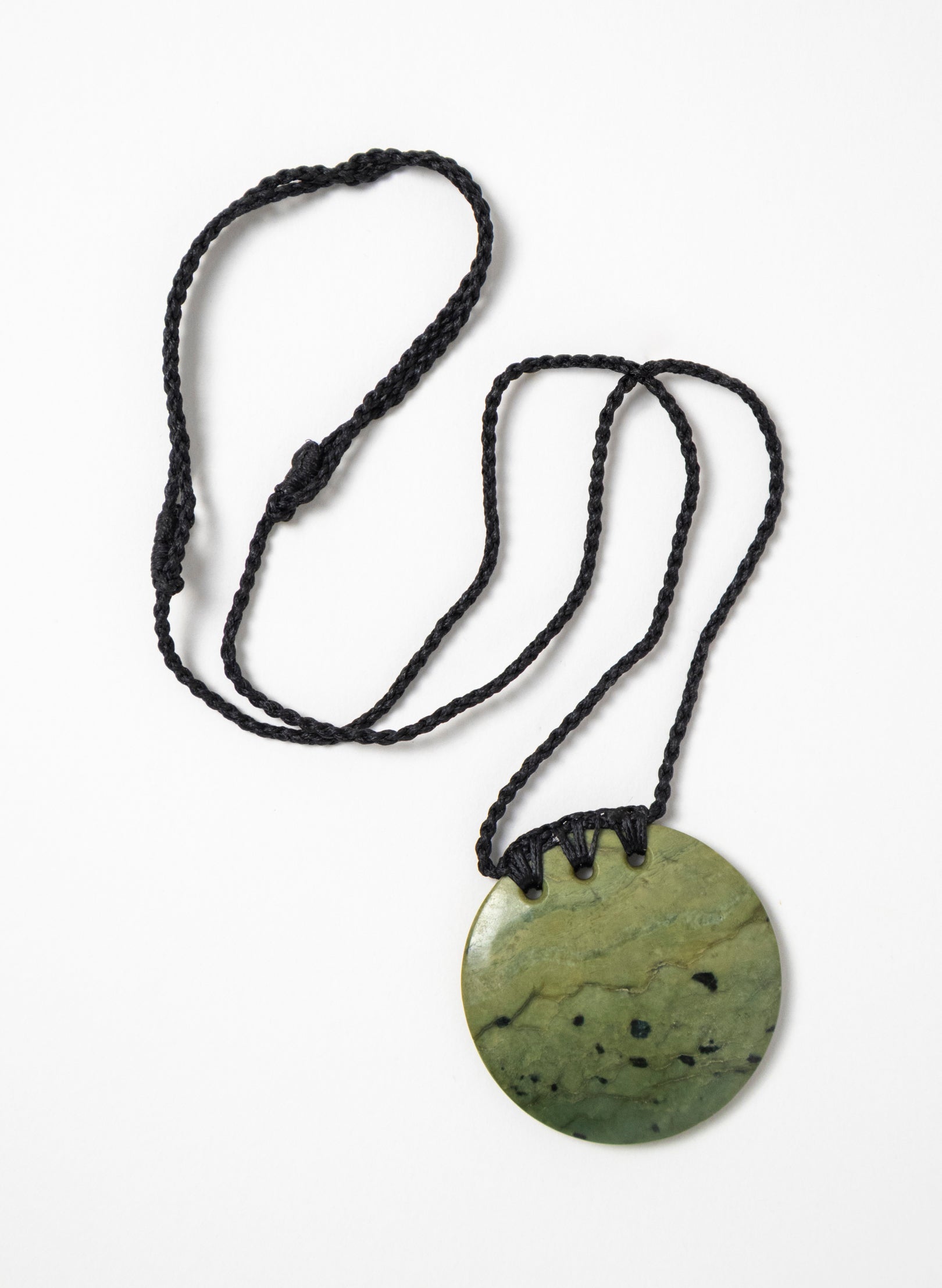 Carved Pounamu Porowhita Disc