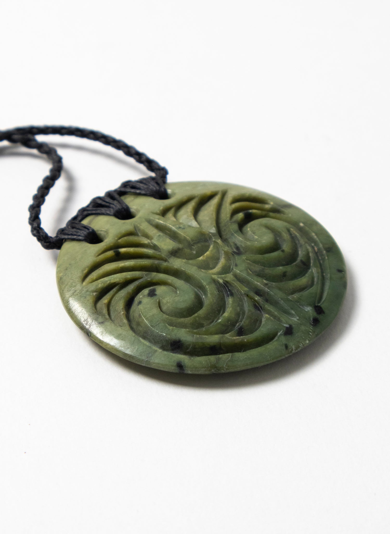 Carved Pounamu Porowhita Disc