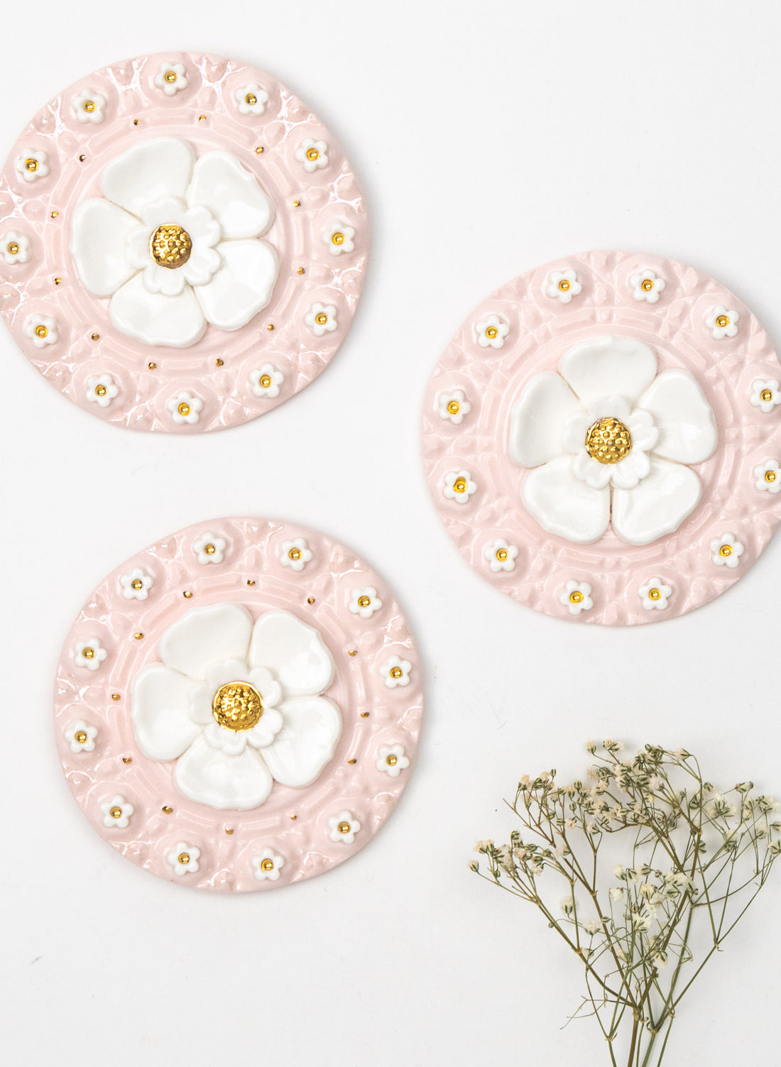 Round Pink Wall Plate with White and Gold Flowers