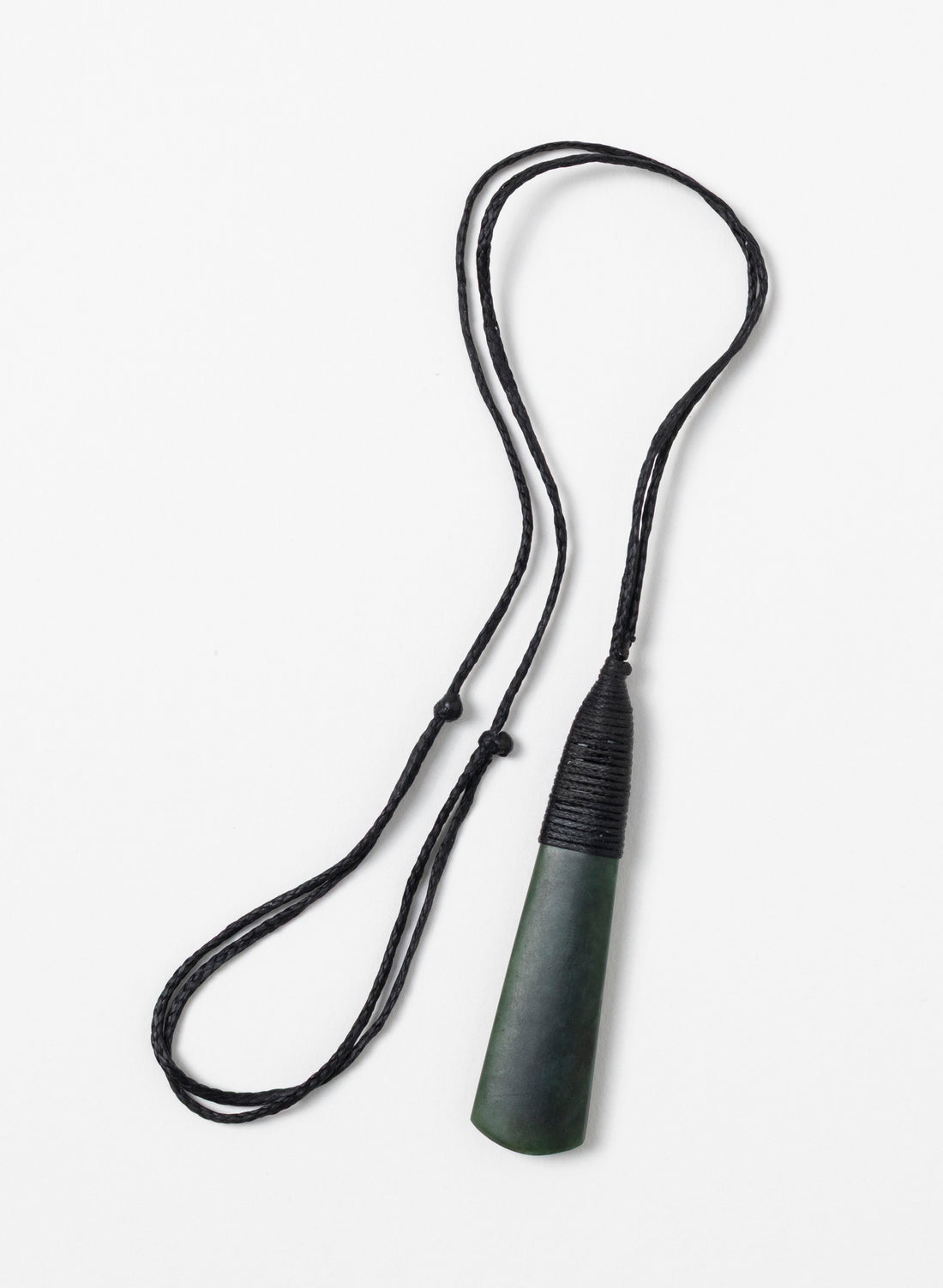 Kawakawa pounamu toki pendant with its full black cord