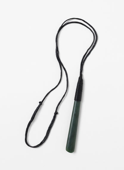 Long narrow Kawakawa pounamu toki pendant with its full black cord