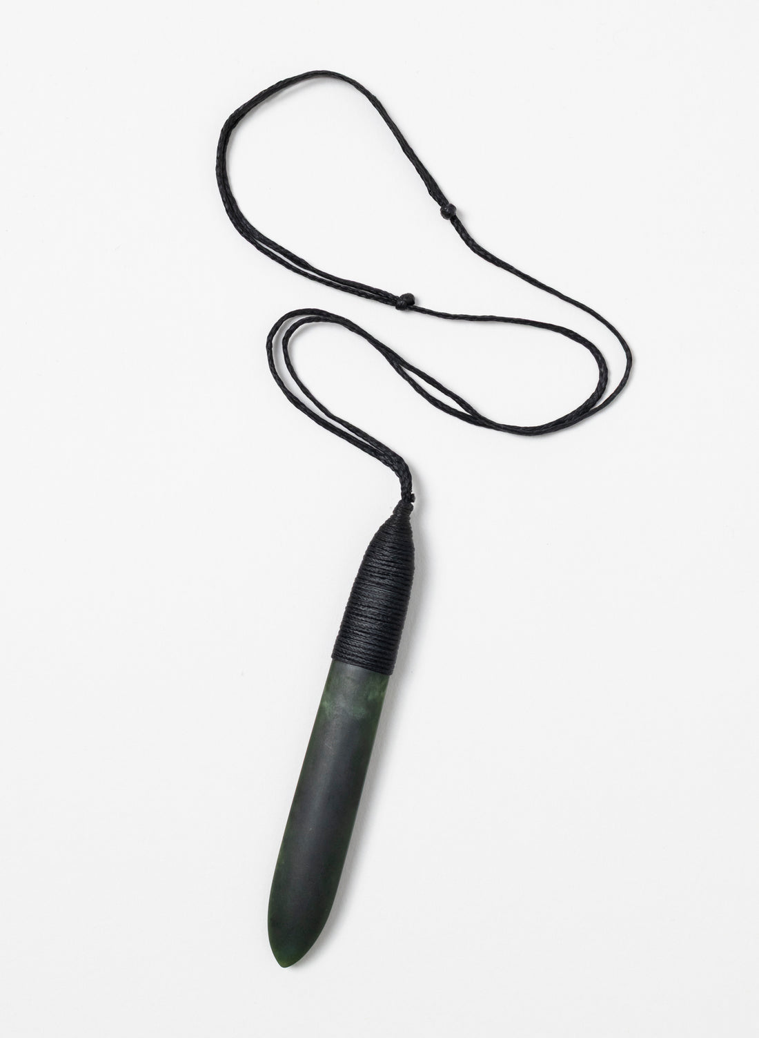 Long Kawakawa pounamu roimata pendant with its full black cord
