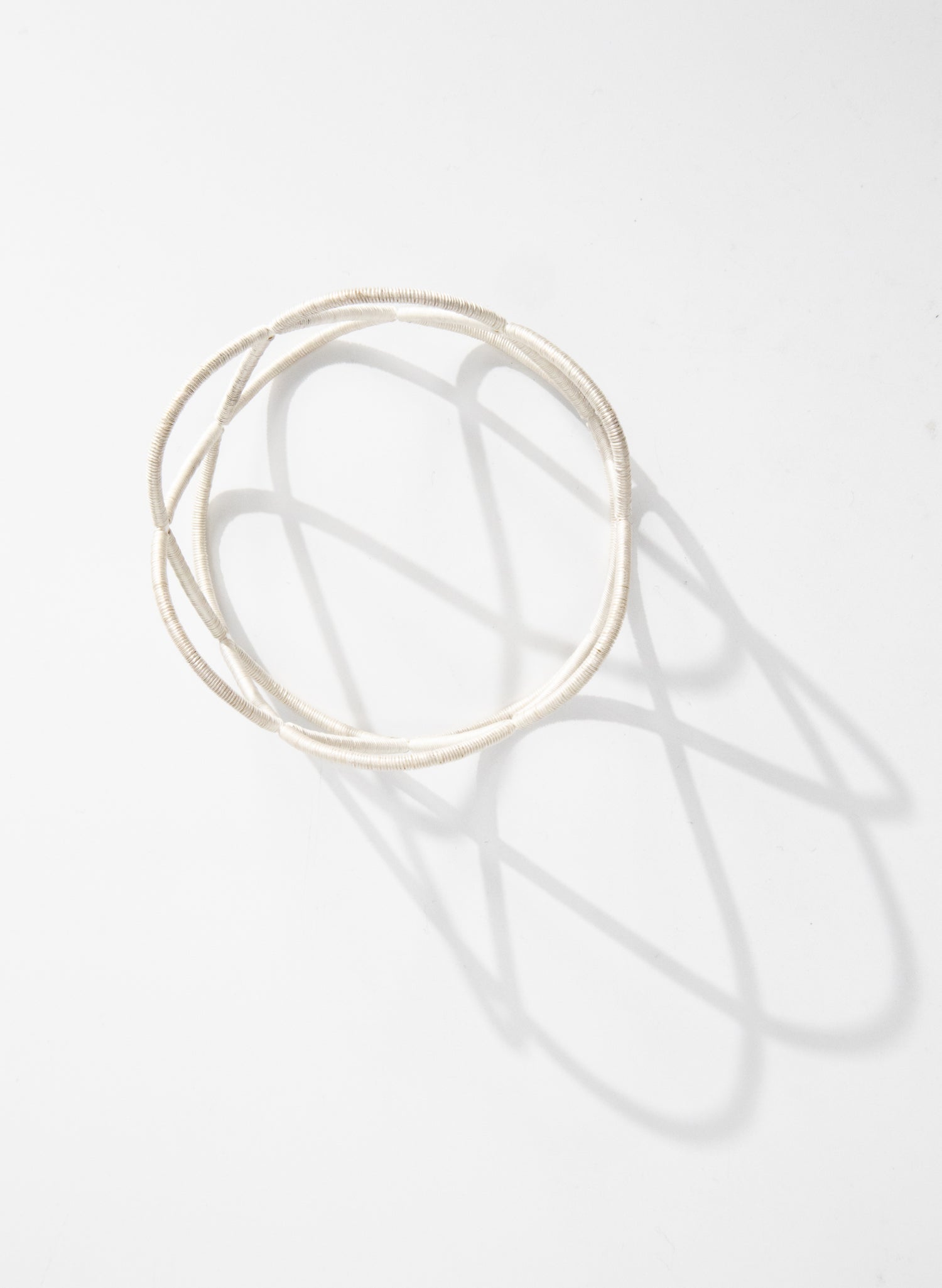 Triple Twist Silver Bangle