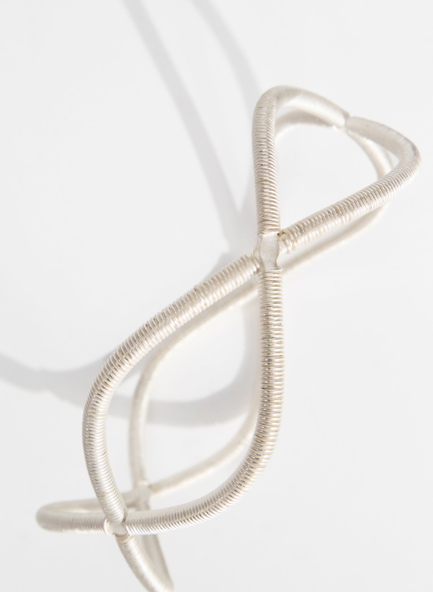 Double Twist Silver Bangle