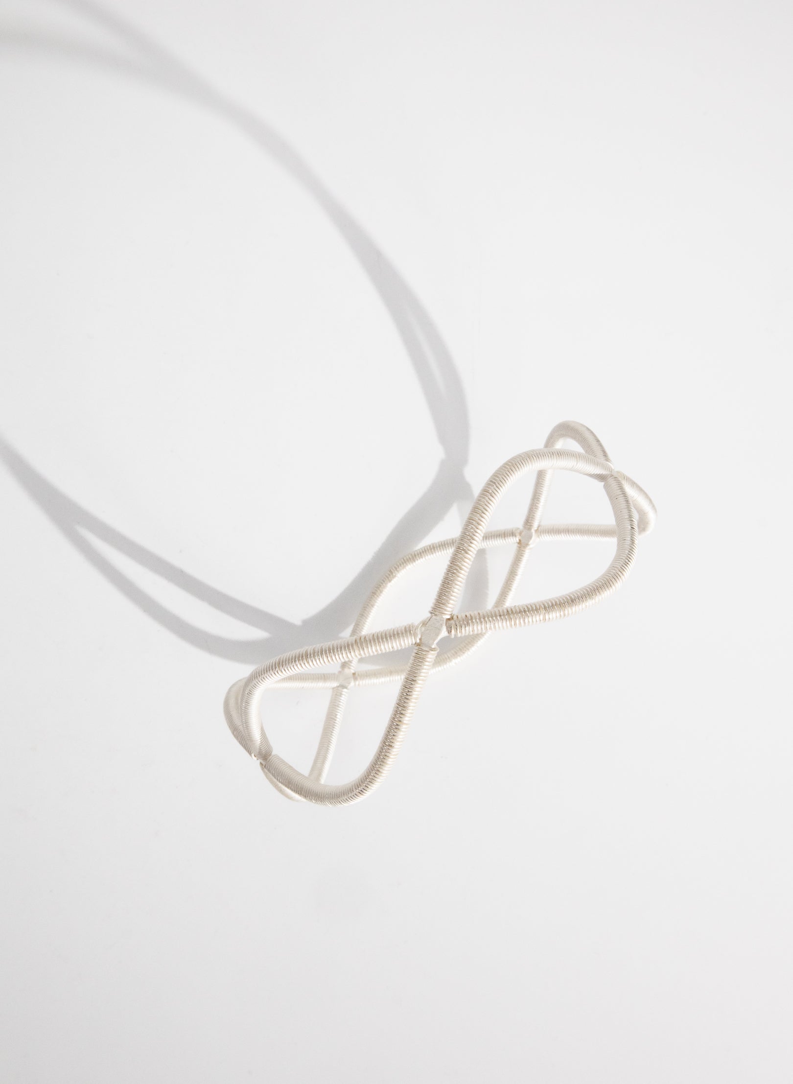 Double Twist Silver Bangle