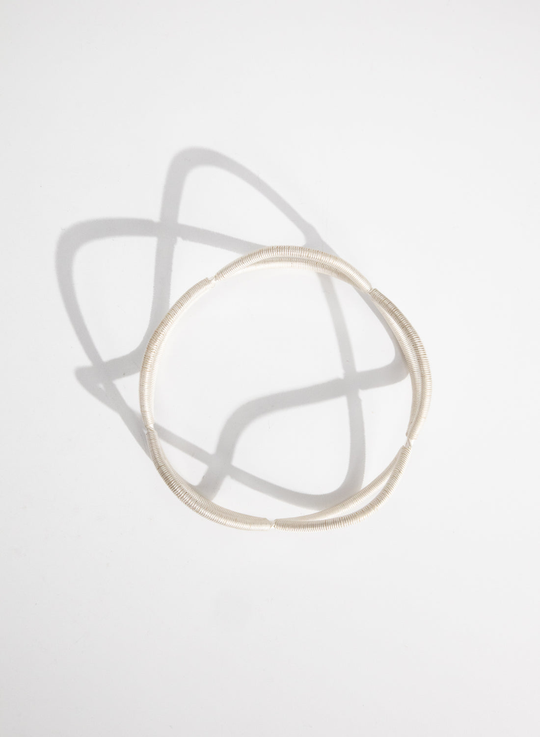 Double Twist Silver Bangle