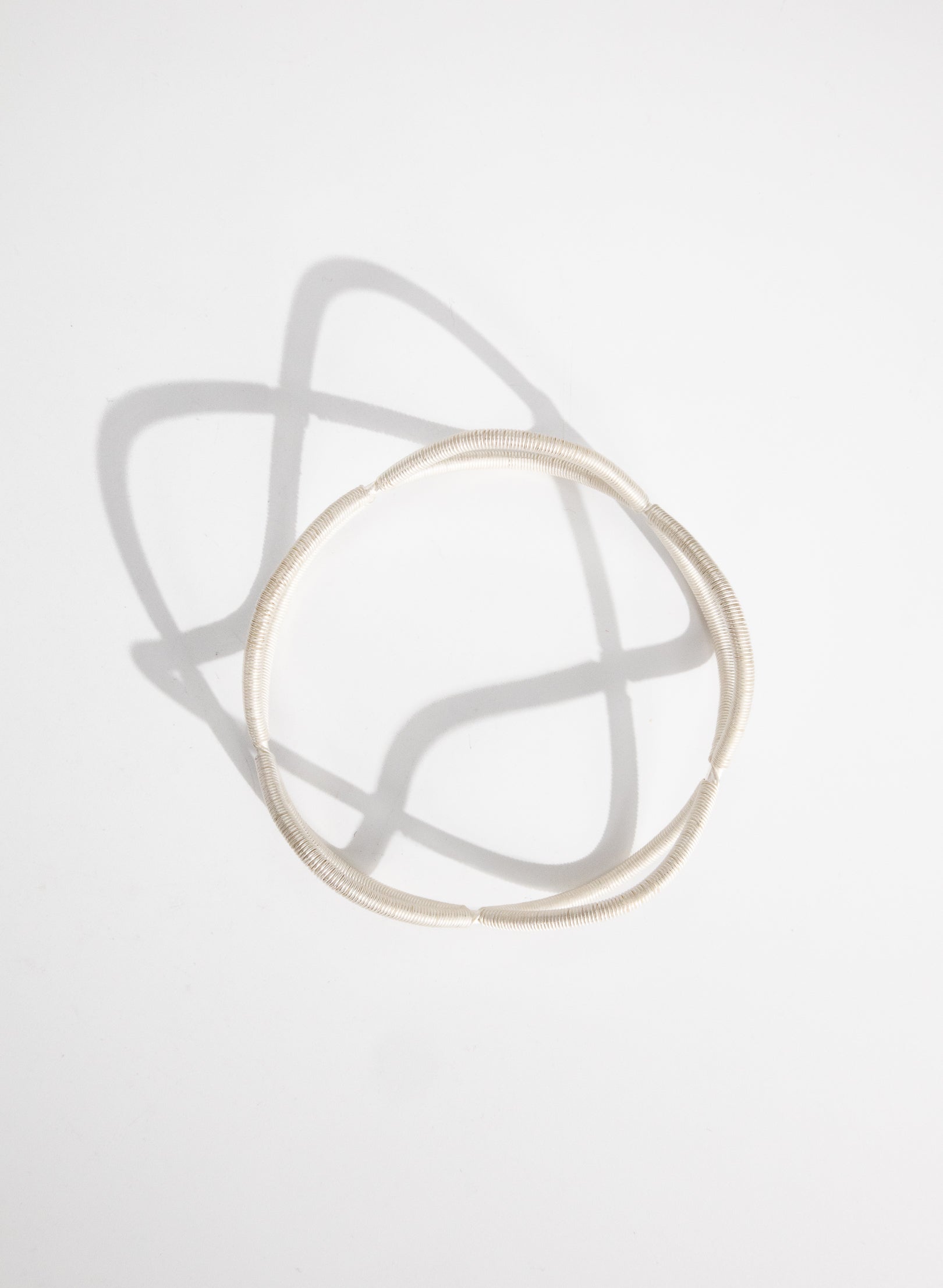 Double Twist Silver Bangle
