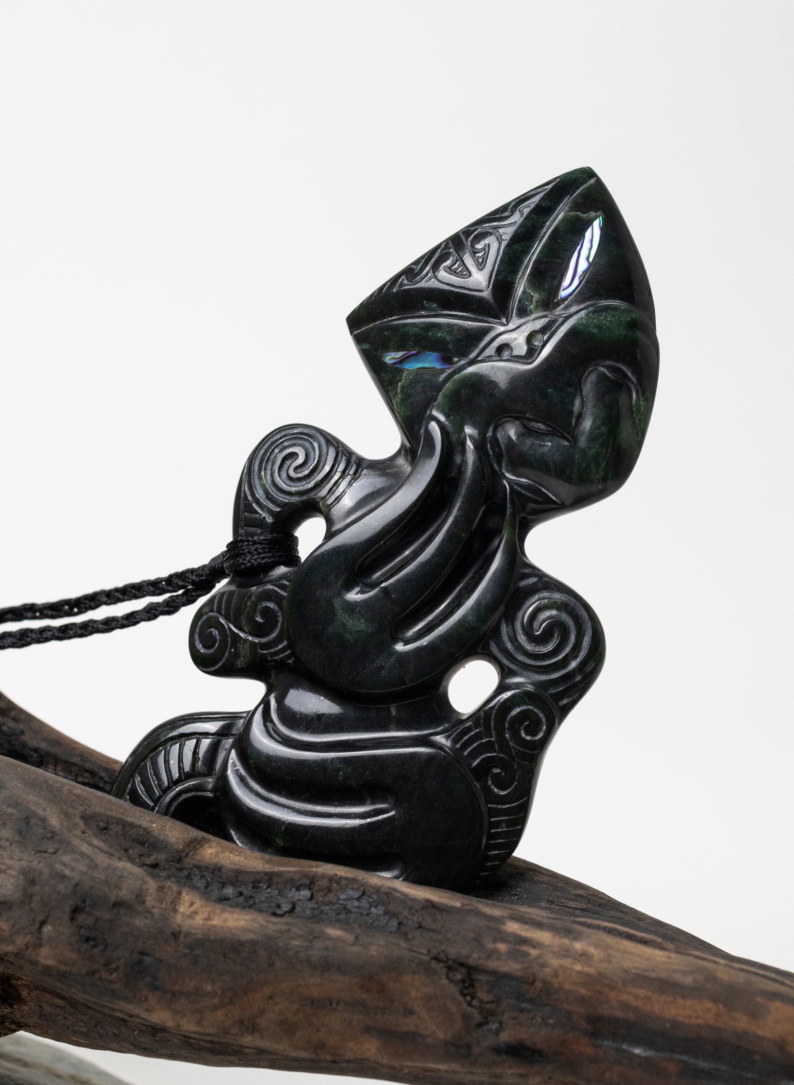 Pounamu Hei Tiki on Stone Base