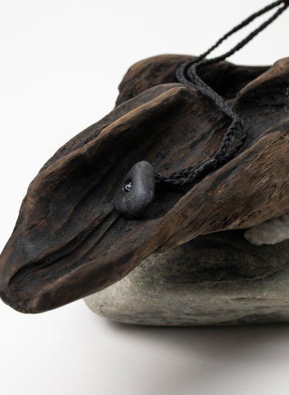 Pounamu Hei Tiki on Stone Base