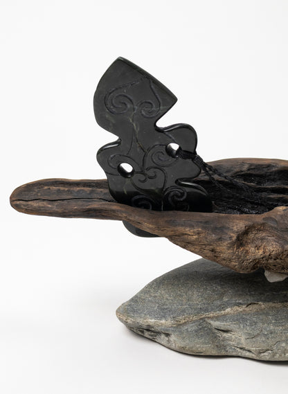Pounamu Hei Tiki on Stone Base
