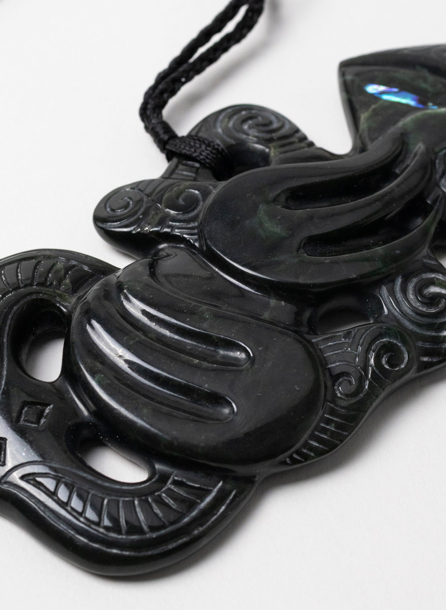 Pounamu Hei Tiki on Stone Base