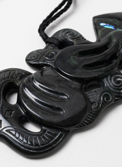 Pounamu Hei Tiki on Stone Base