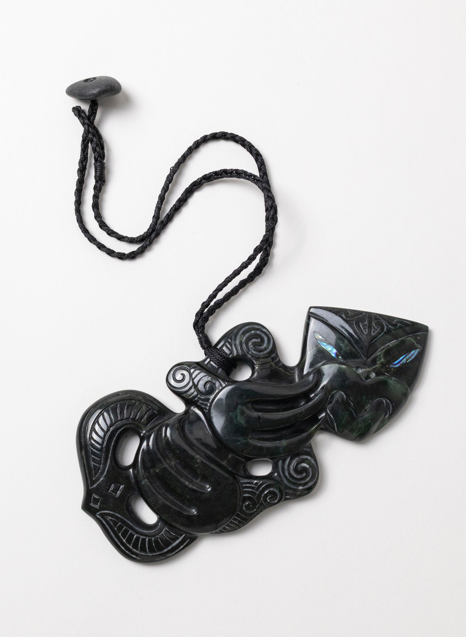 Pounamu Hei Tiki on Stone Base