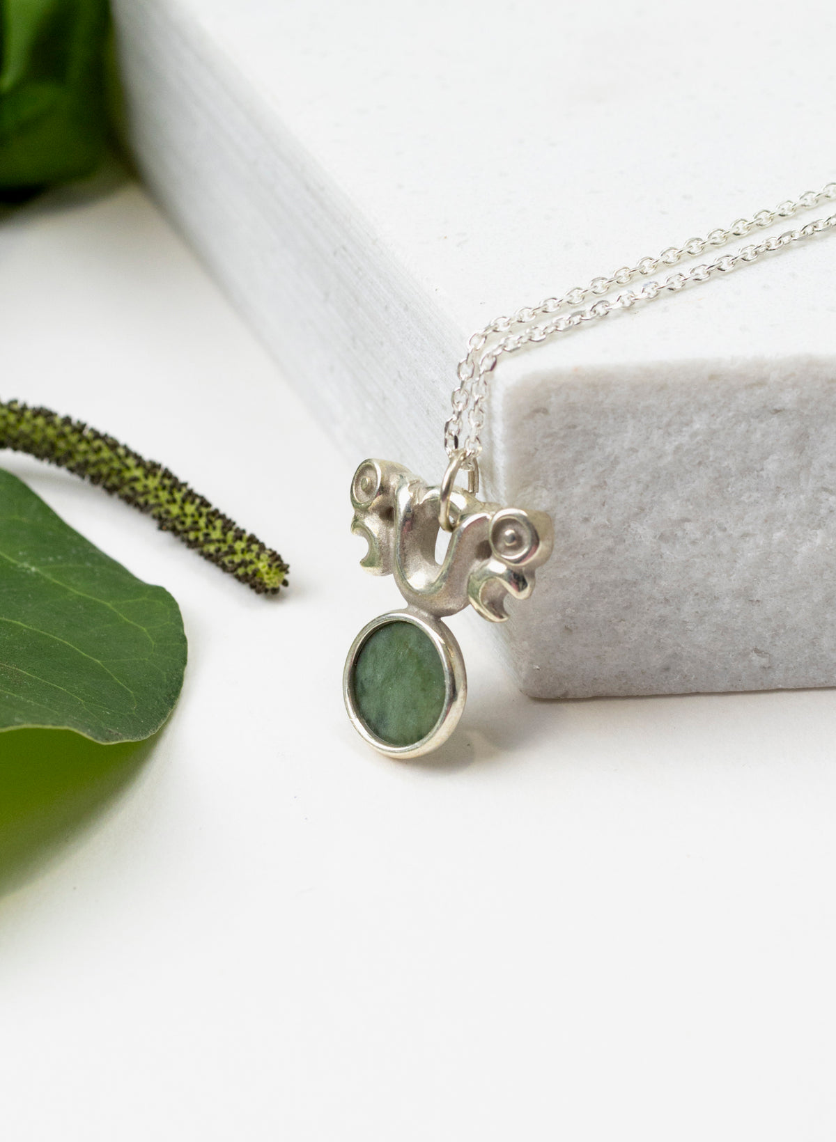 Silver Pekapeka Pendant with Pounamu Disc