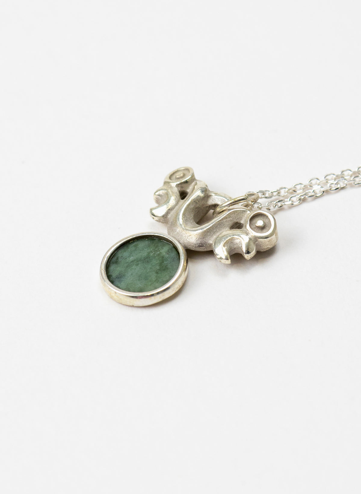 Silver Pekapeka Pendant with Pounamu Disc
