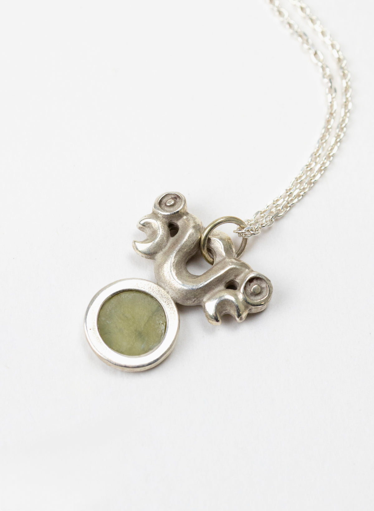 Silver Pekapeka Pendant with Pounamu Disc
