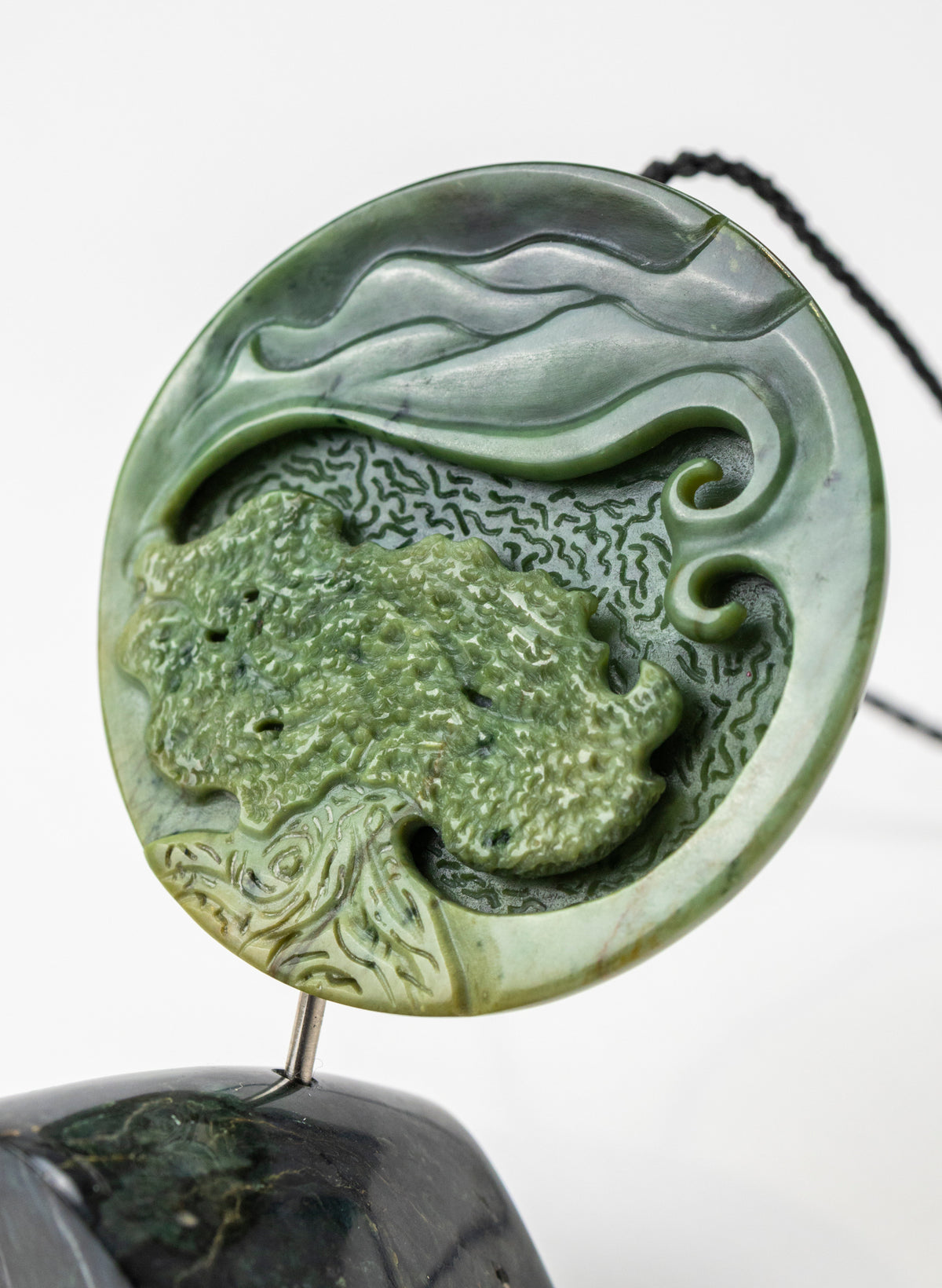 Carved Pounamu Porohita Sculpture on a Stand