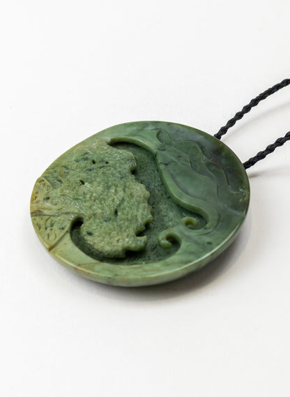 Carved Pounamu Porohita Sculpture on a Stand