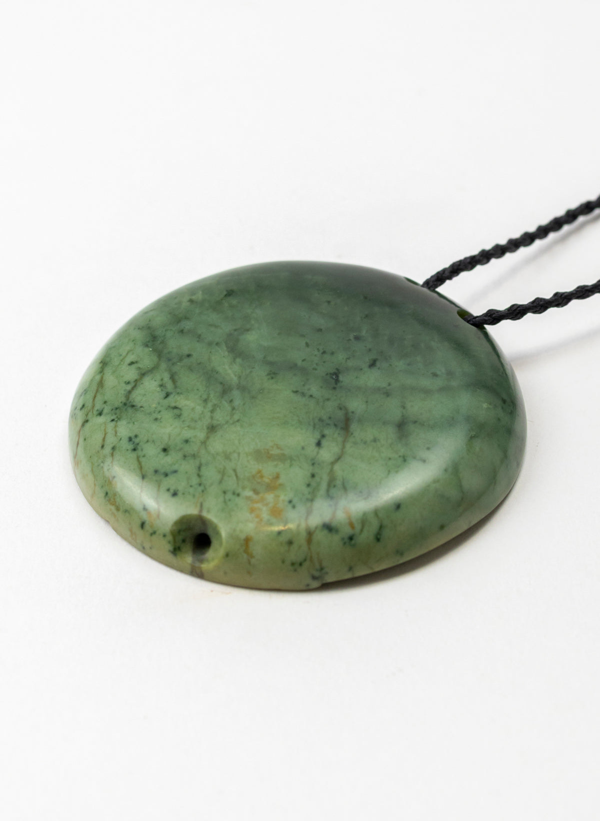 Carved Pounamu Porohita Sculpture on a Stand